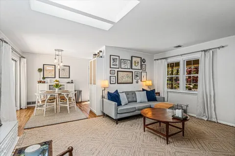 a living room with furniture and a table