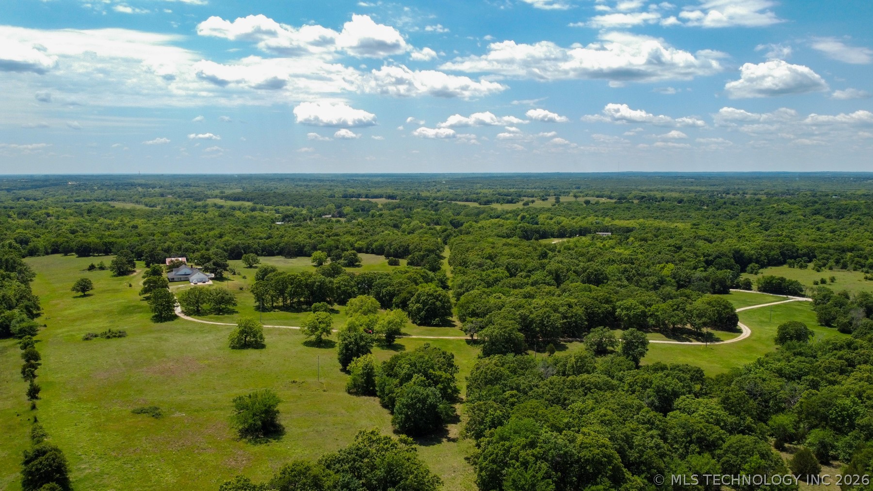 13248 North 3540th Road Maud, OK 74854 - Photo 29 of 98 Expansive property featuring verdant tree cover and open grassy areas