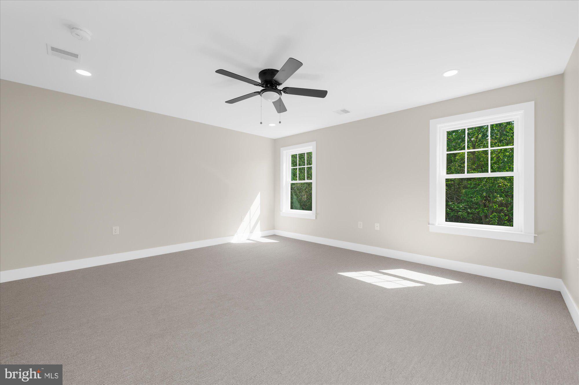 394 Renninger Road Perkiomenville, PA 18074 - Photo 35 of 41 an empty room with windows and fan