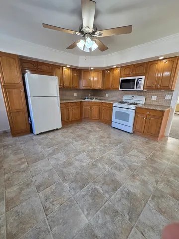 a view of a kitchen with a sink