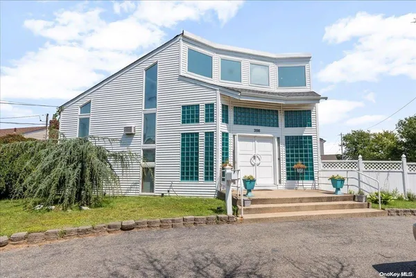 a front view of house with small garden