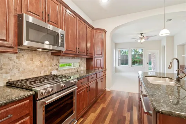 a bedroom with a large bed and a large window