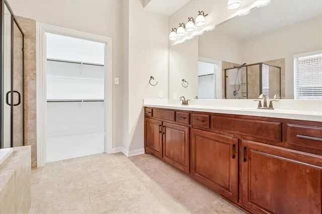 a bedroom with a bed and a flat tv screen