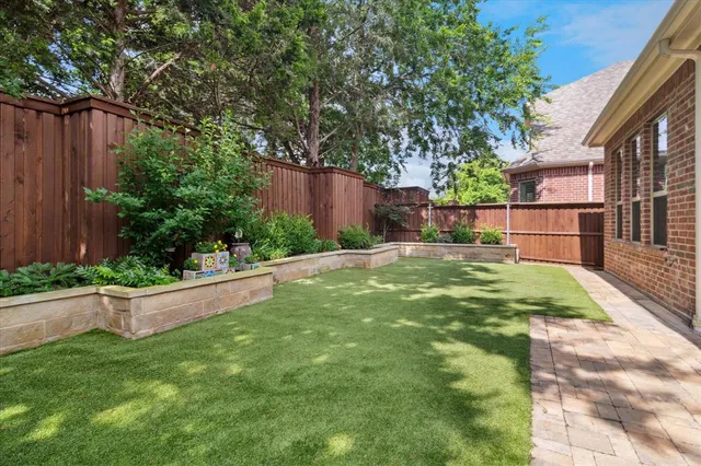 a backyard of a house with lots of green space