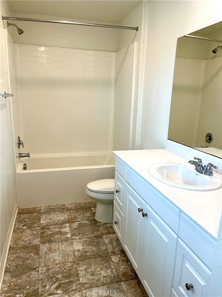 1586 Redwoods Drive Place Upland, CA 91784 - Photo 12 of 18 a bathroom with a sink a toilet and a bathtub