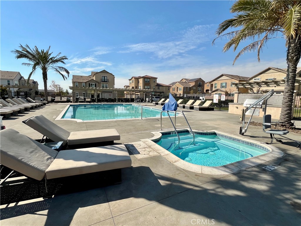 1586 Redwoods Drive Place Upland, CA 91784 - Photo 17 of 18 a view of a backyard with a patio and swimming pool