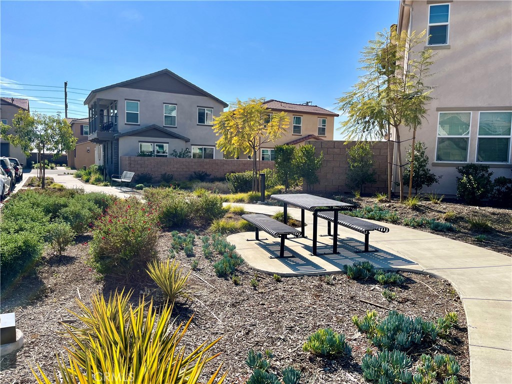 1586 Redwoods Drive Place Upland, CA 91784 - Photo 18 of 18 a view of a house with a yard and sitting area