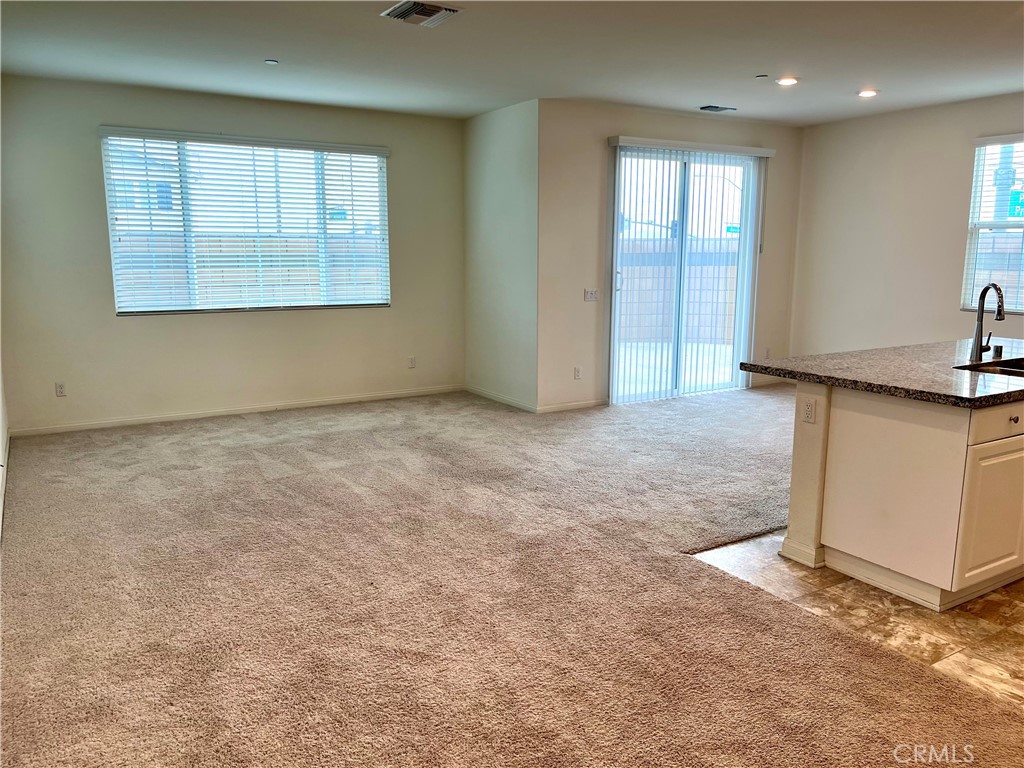 1586 Redwoods Drive Place Upland, CA 91784 - Photo 6 of 18 an empty room with windows