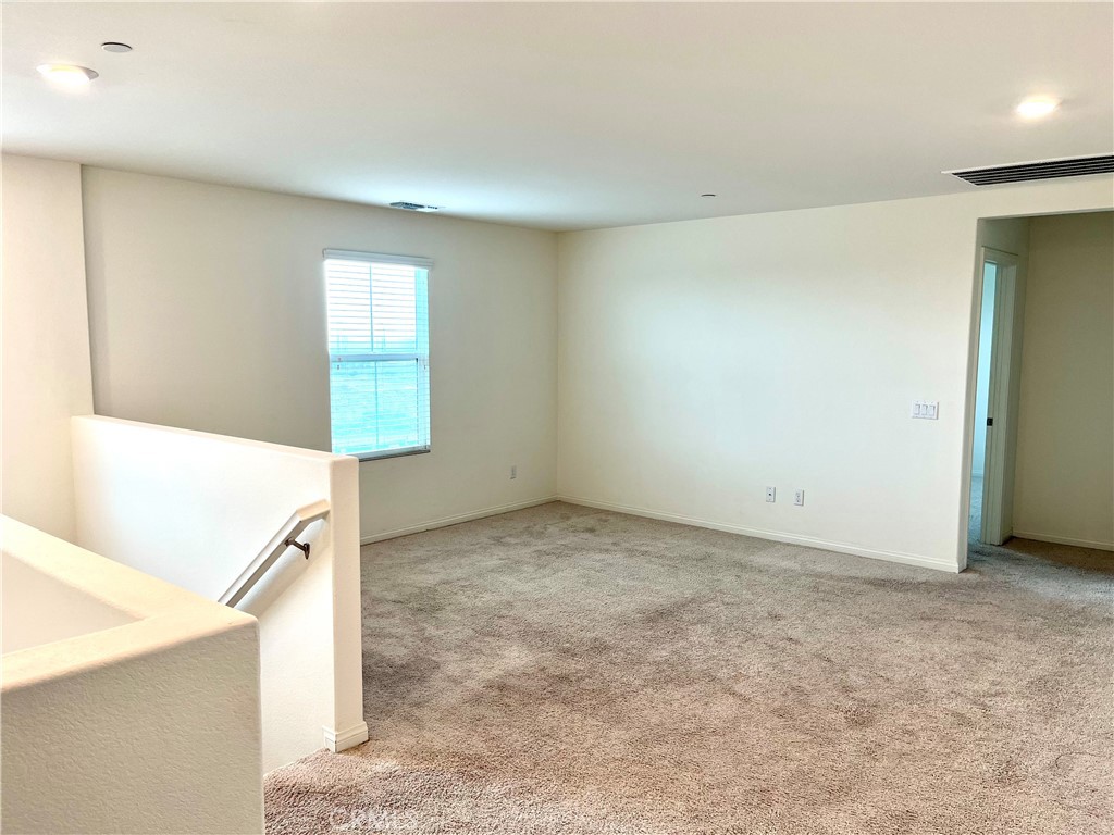1586 Redwoods Drive Place Upland, CA 91784 - Photo 8 of 18 a view of an empty room