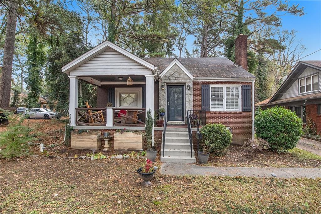 976 Cascade Road Southwest Atlanta, GA 30311 - Photo 1 of 1 a view of the house and front view of a house