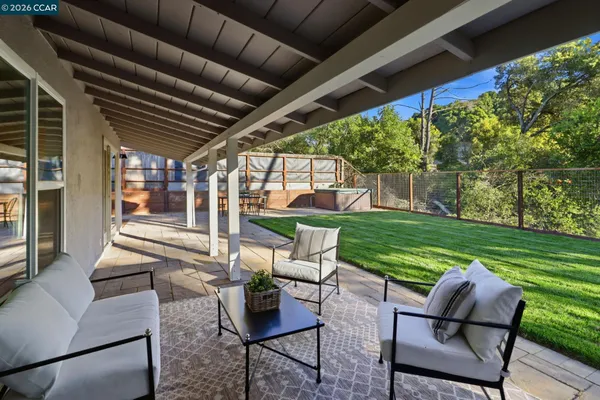a patio with yard table and chairs
