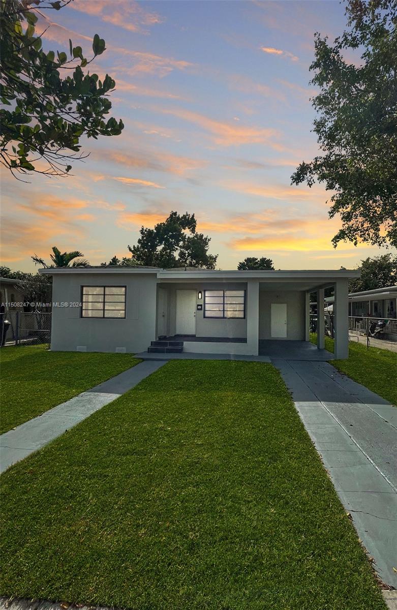 a view of a yard with a house and garden