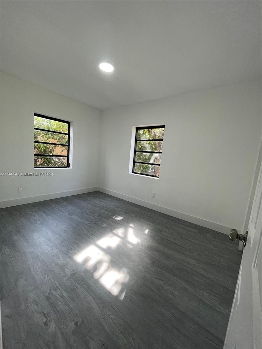 50 East 13th Street Hialeah, FL 33010 - Photo 12 of 17 an empty room with windows
