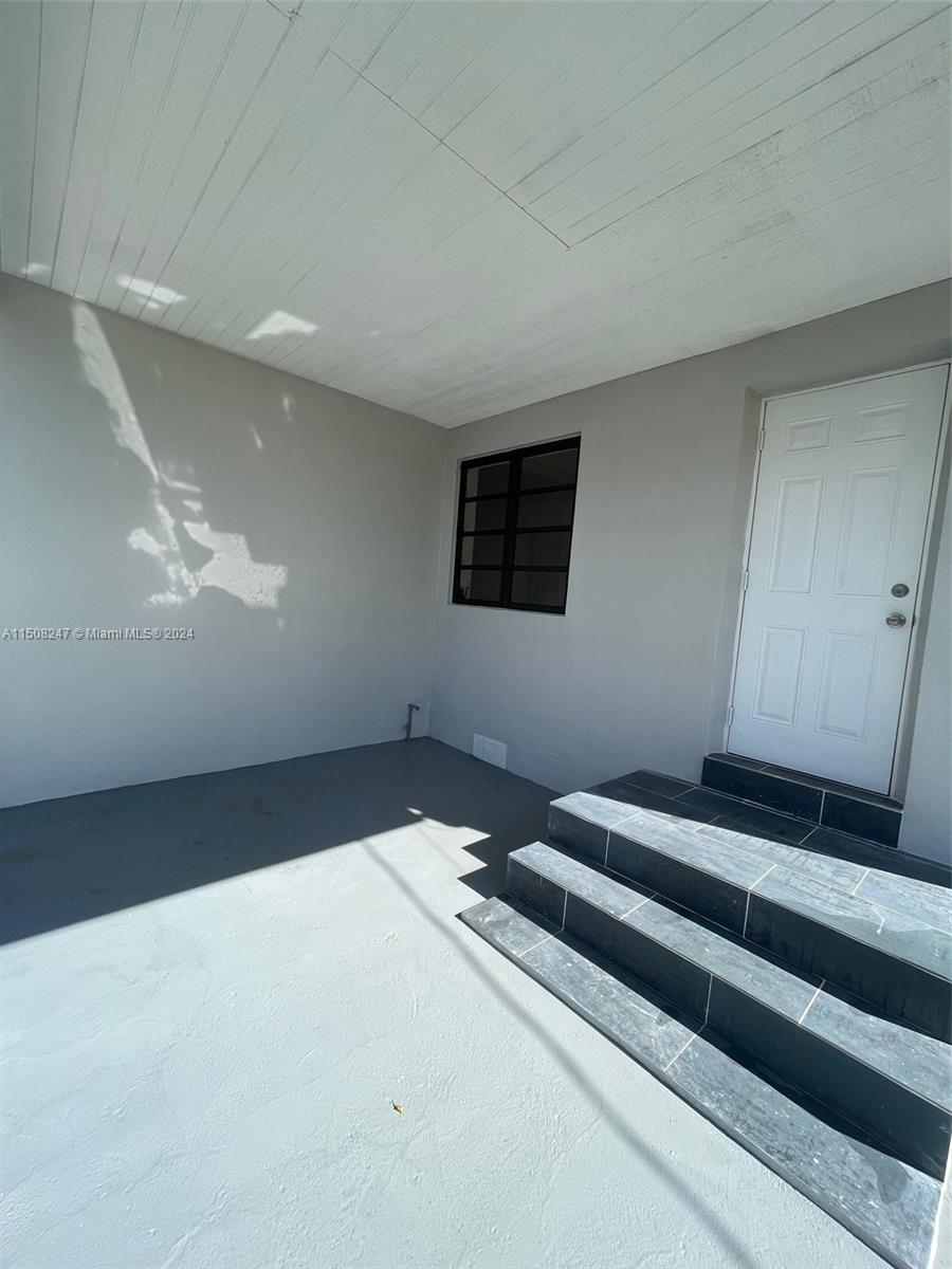 50 East 13th Street Hialeah, FL 33010 - Photo 15 of 17 a bedroom with bed