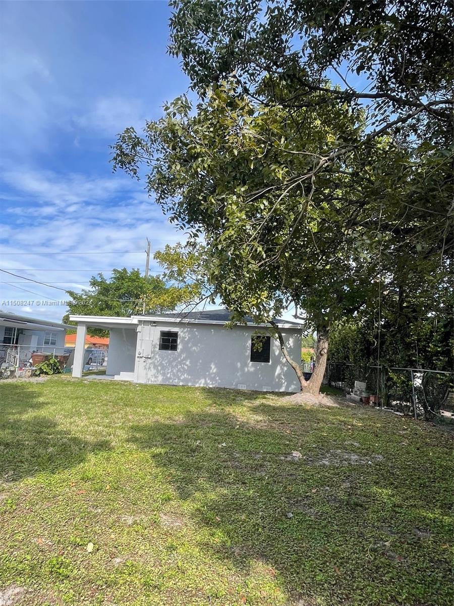 50 East 13th Street Hialeah, FL 33010 - Photo 16 of 17 a view of a house with a yard