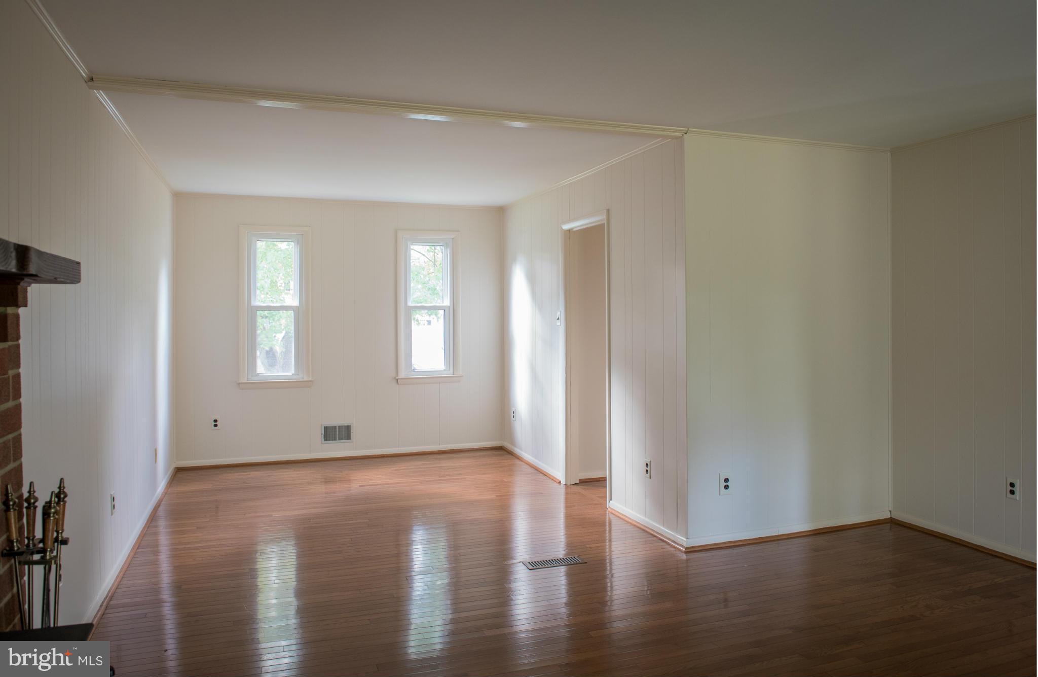 3213 Llewellyn Field Road Olney, MD 20832 - Photo 19 of 30 an empty room with wooden floor and windows
