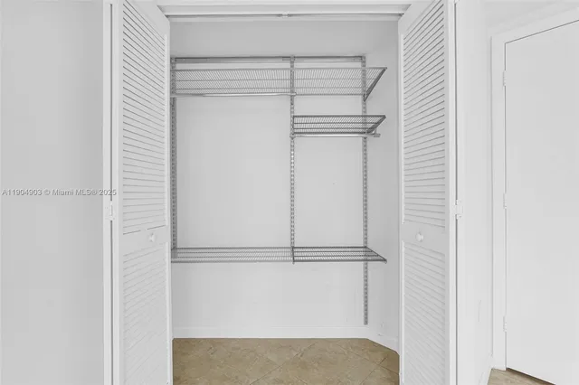 a kitchen with stainless steel appliances granite countertop a stove and cabinets