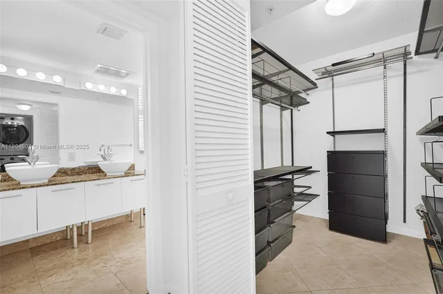 a view of a room with wooden walls and furniture