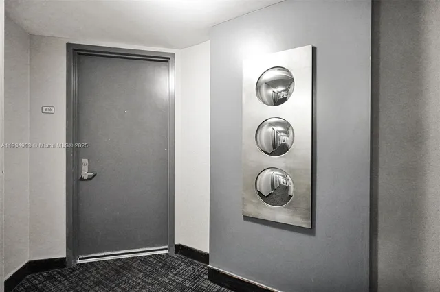 a view of an empty room with glass door