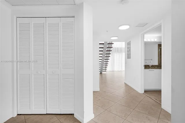 a view of an empty room with glass door