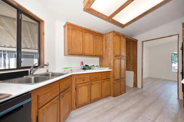 a kitchen with a sink and cabinets