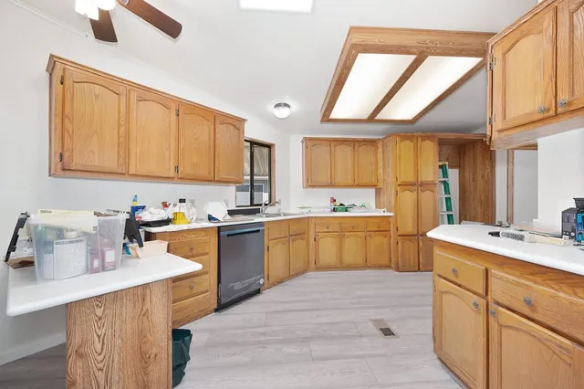 a kitchen with a sink stove and cabinets