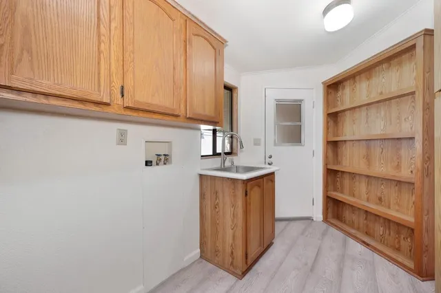 a kitchen with stainless steel appliances granite countertop a sink and cabinets