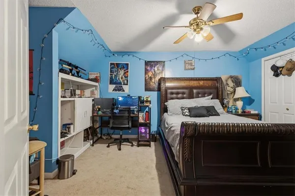 a bedroom with furniture and a chandelier