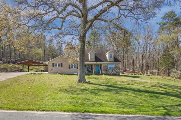 a front view of a house with a yard