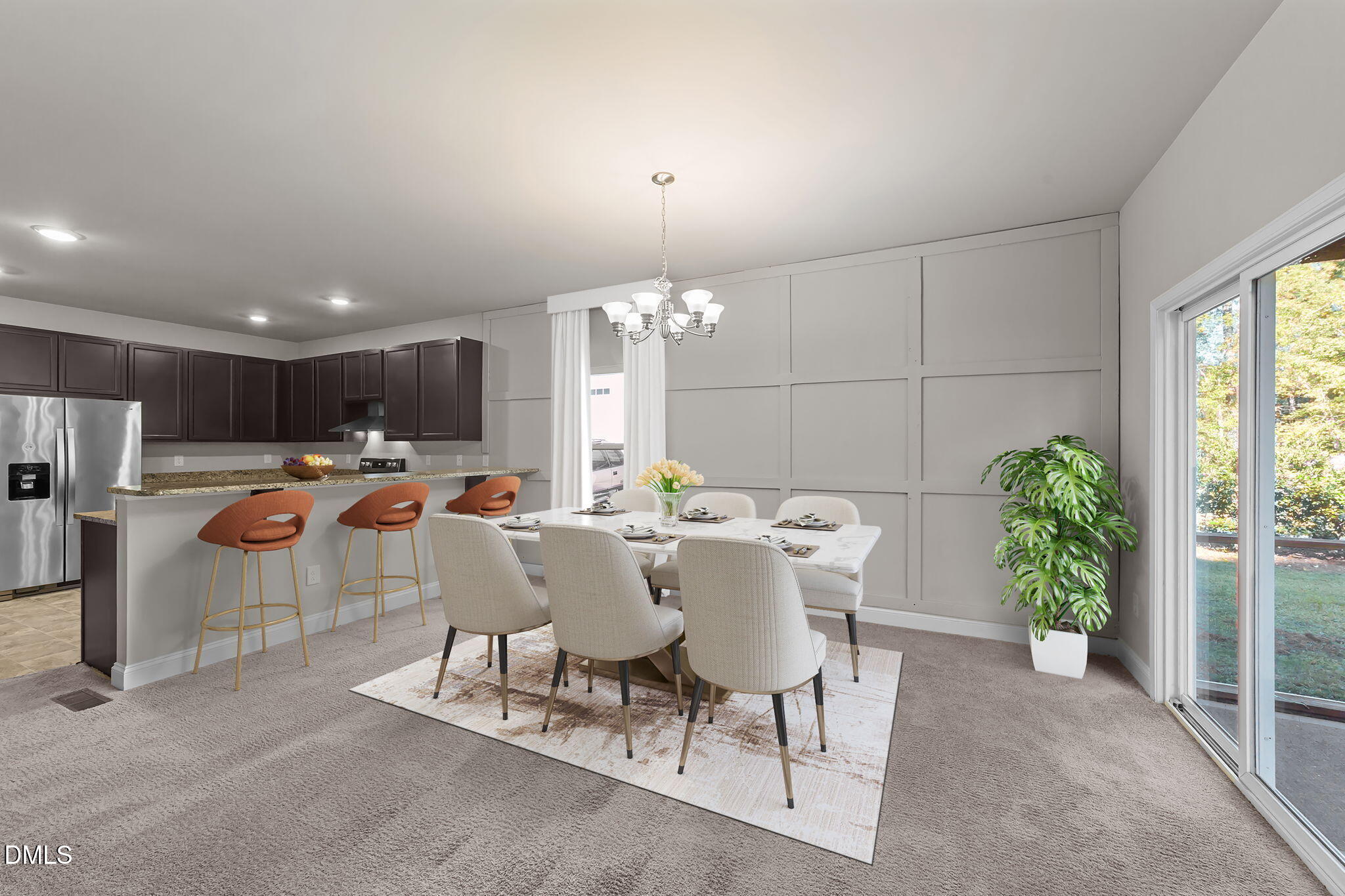 a view of a dining room with furniture a livingroom and chandelier