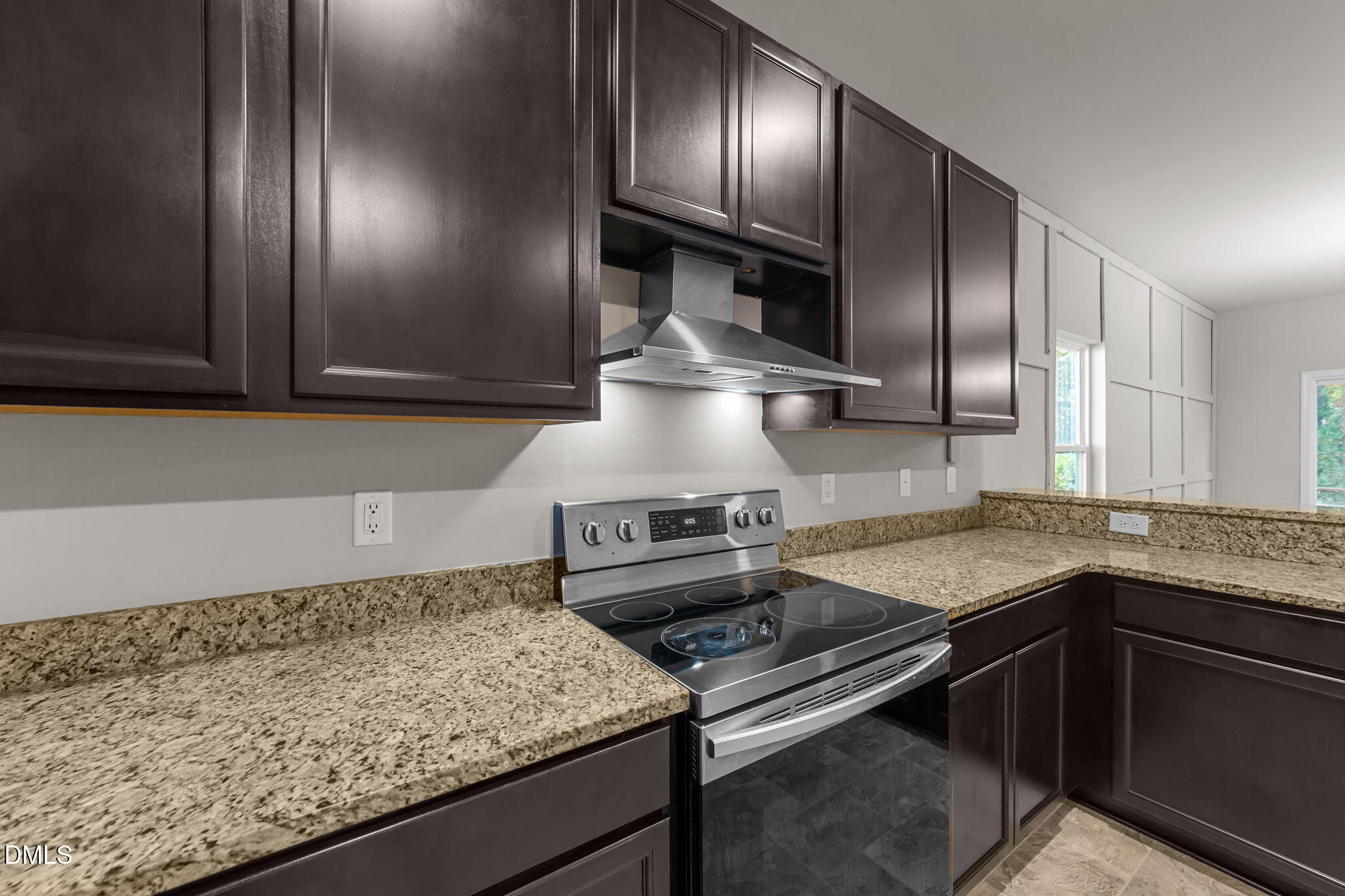 2504 Fleming Road Fuquay-Varina, NC 27526 - Photo 15 of 41 a kitchen with granite countertop stainless steel appliances and wooden cabinets