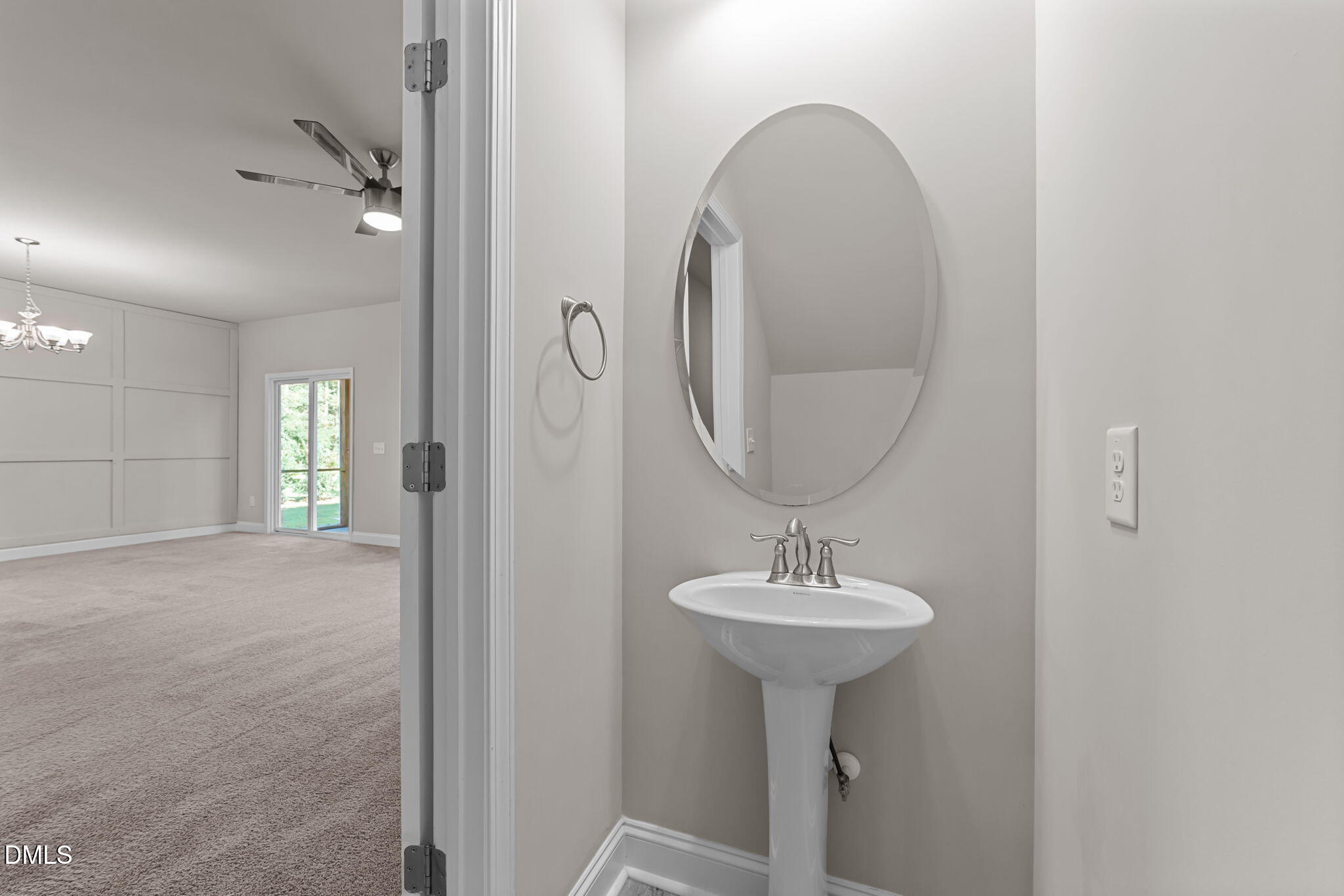 2504 Fleming Road Fuquay-Varina, NC 27526 - Photo 17 of 41 a bathroom with a sink a mirror and a window