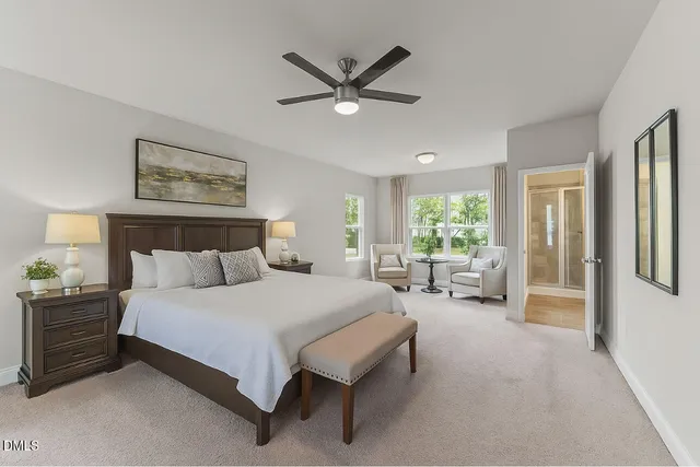 a bedroom with a bed couch and a window