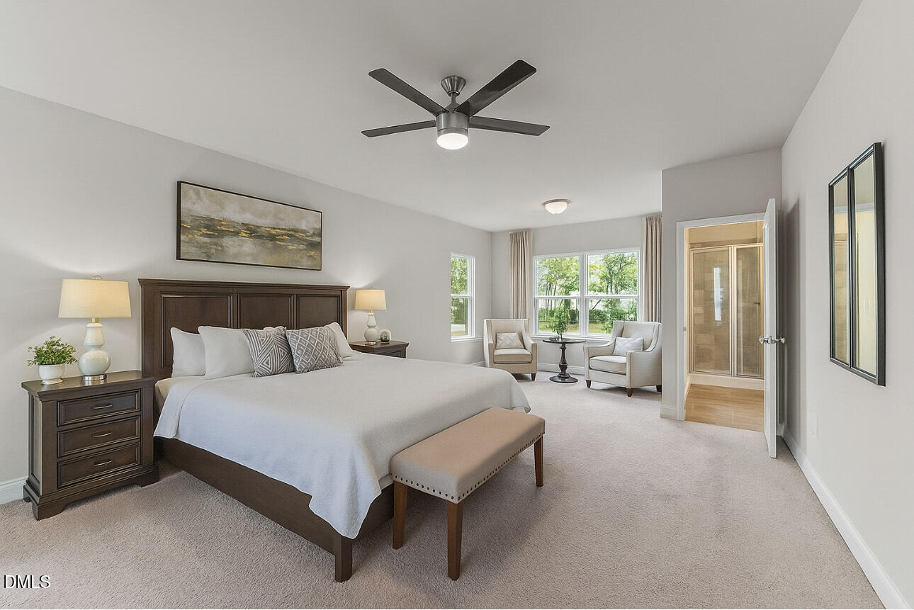 2504 Fleming Road Fuquay-Varina, NC 27526 - Photo 19 of 41 a bedroom with a bed couch and a window