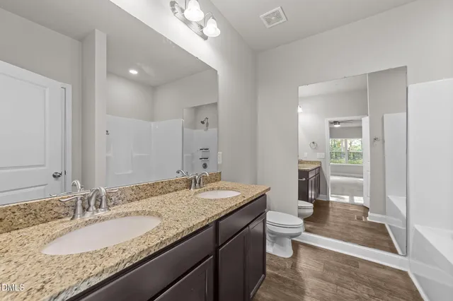 a bathroom with a bathtub and shower