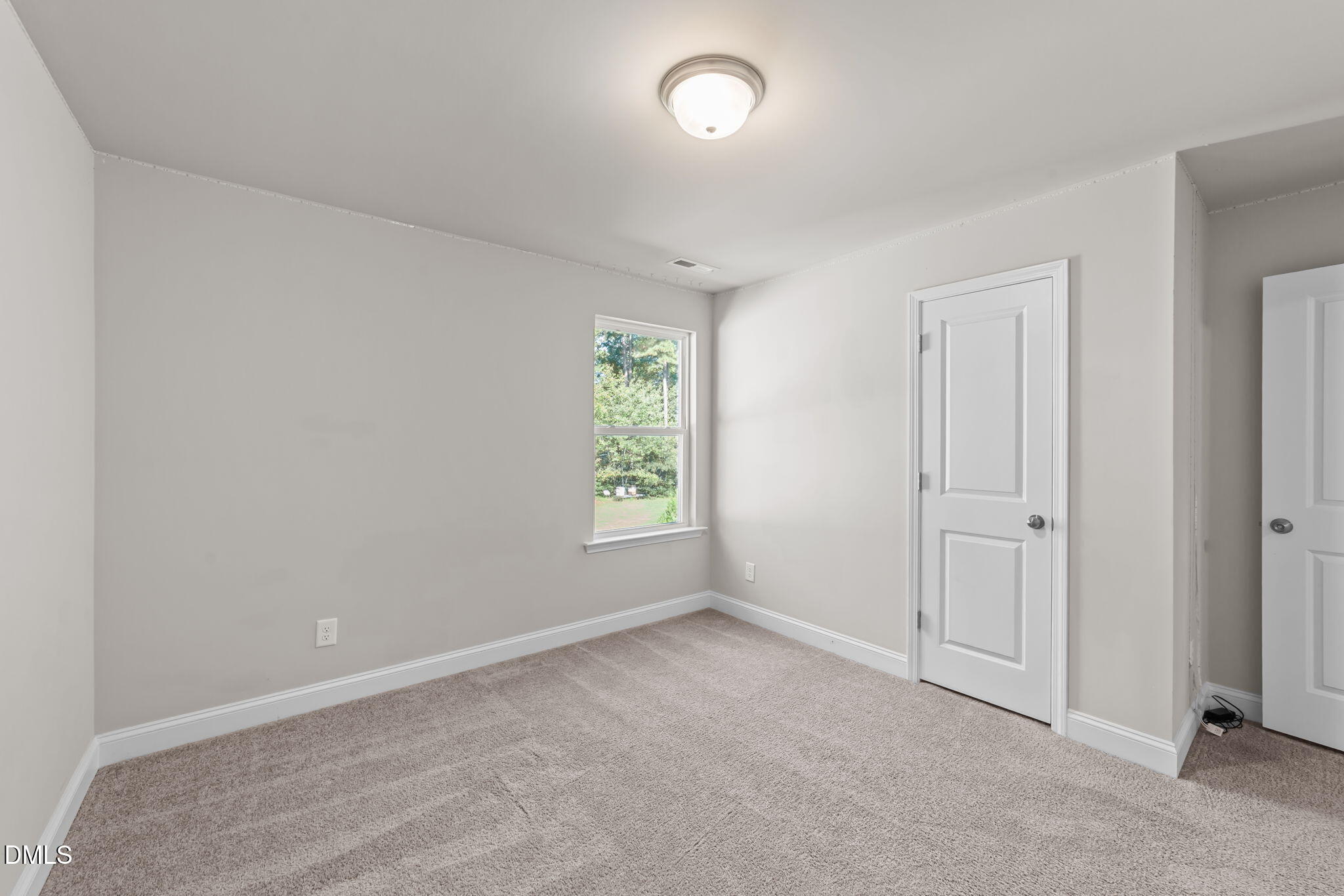 2504 Fleming Road Fuquay-Varina, NC 27526 - Photo 35 of 41 an empty room with windows and closet