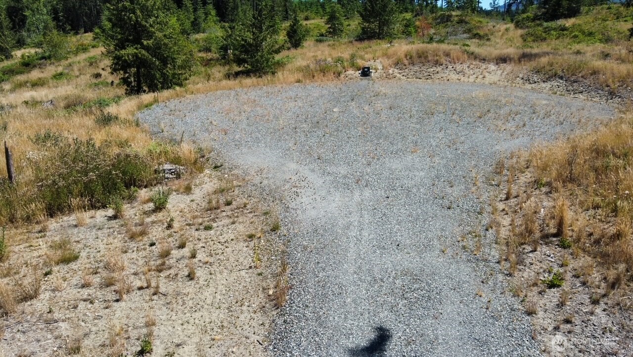 1422 East Sequim Bay Road Sequim, WA 98382 - Photo 5 of 19 a view of a dry field with trees in the background