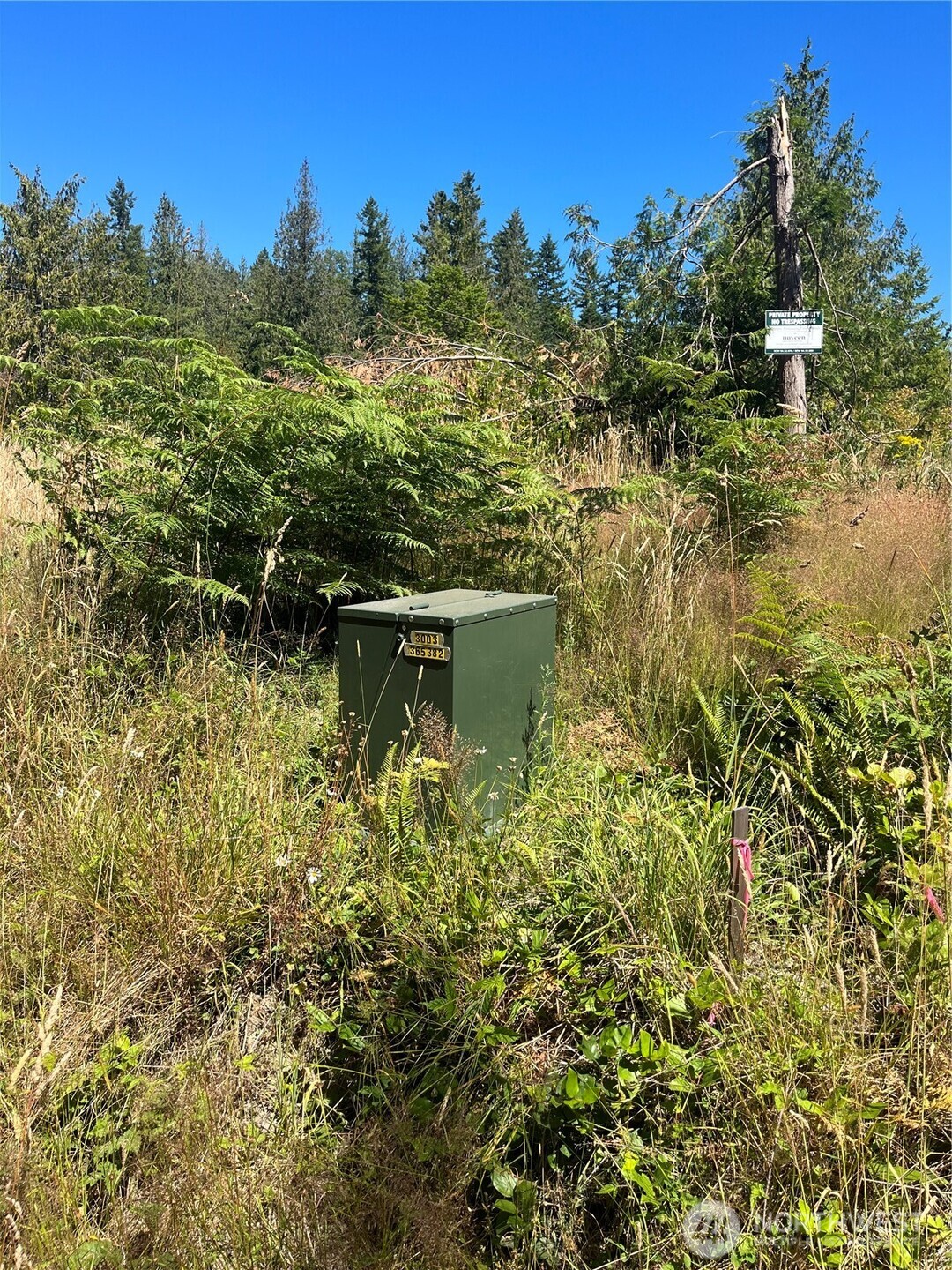 1422 East Sequim Bay Road Sequim, WA 98382 - Photo 10 of 19 a view of a lake with a house in the background