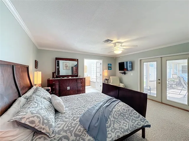 a bathroom with a toilet sink double vanity and mirror