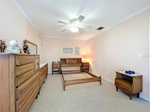 a bedroom with a workspace