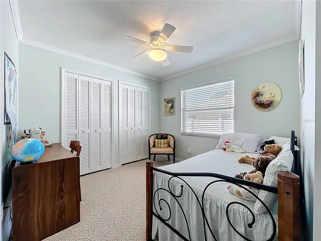 a living room with furniture a window and gym equipment