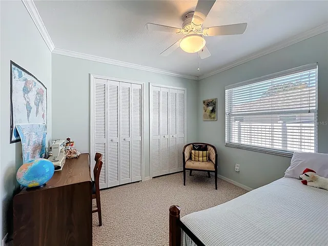 a room with lots of furniture and a large window
