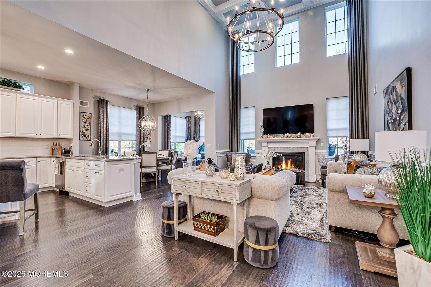 9 Militia Hill Road Freehold, NJ 07728 - Photo 11 of 67 a living room with furniture a fireplace and a flat screen tv