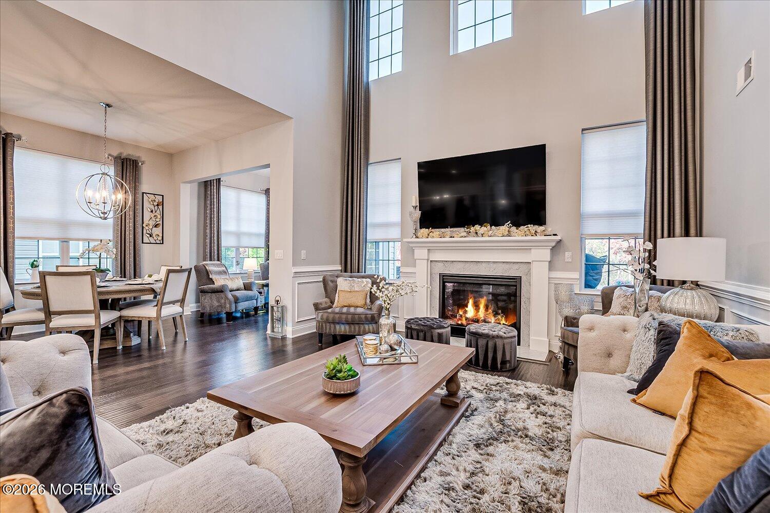 9 Militia Hill Road Freehold, NJ 07728 - Photo 12 of 67 a living room with furniture a flat screen tv and a fireplace