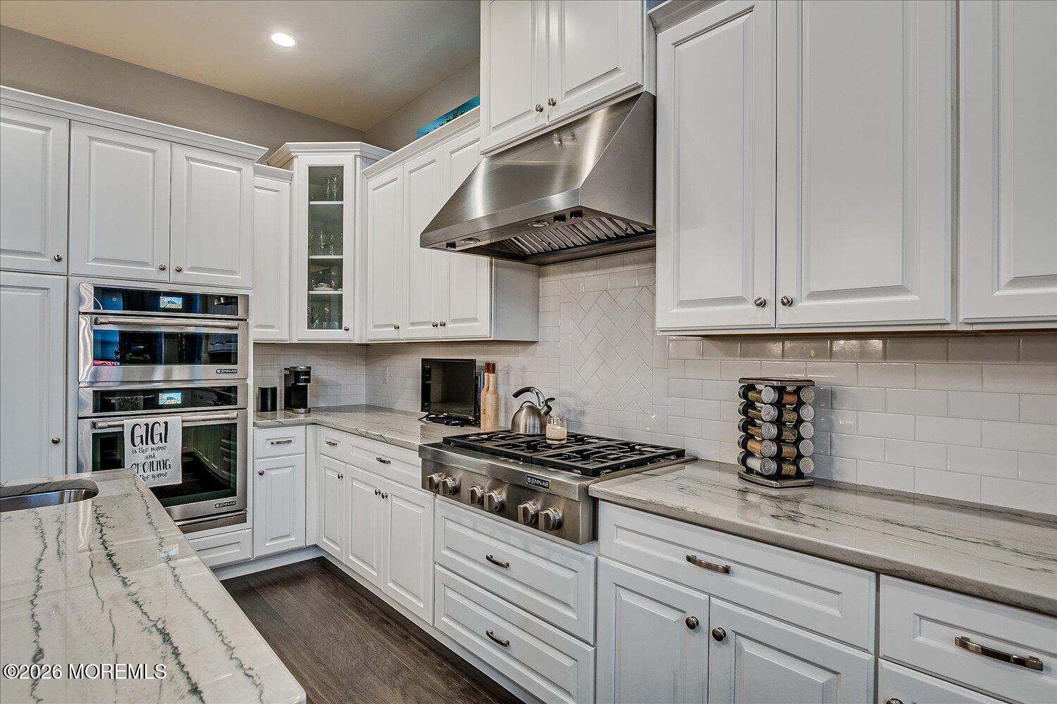 9 Militia Hill Road Freehold, NJ 07728 - Photo 22 of 67 a kitchen with stainless steel appliances granite countertop a sink a stove and cabinets