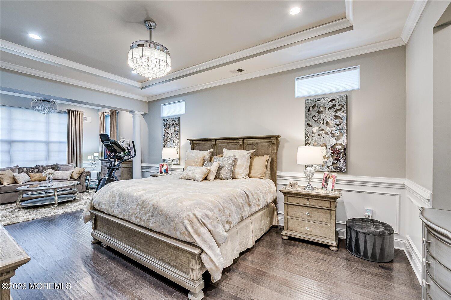 9 Militia Hill Road Freehold, NJ 07728 - Photo 27 of 67 a bedroom with a bed and a chandelier