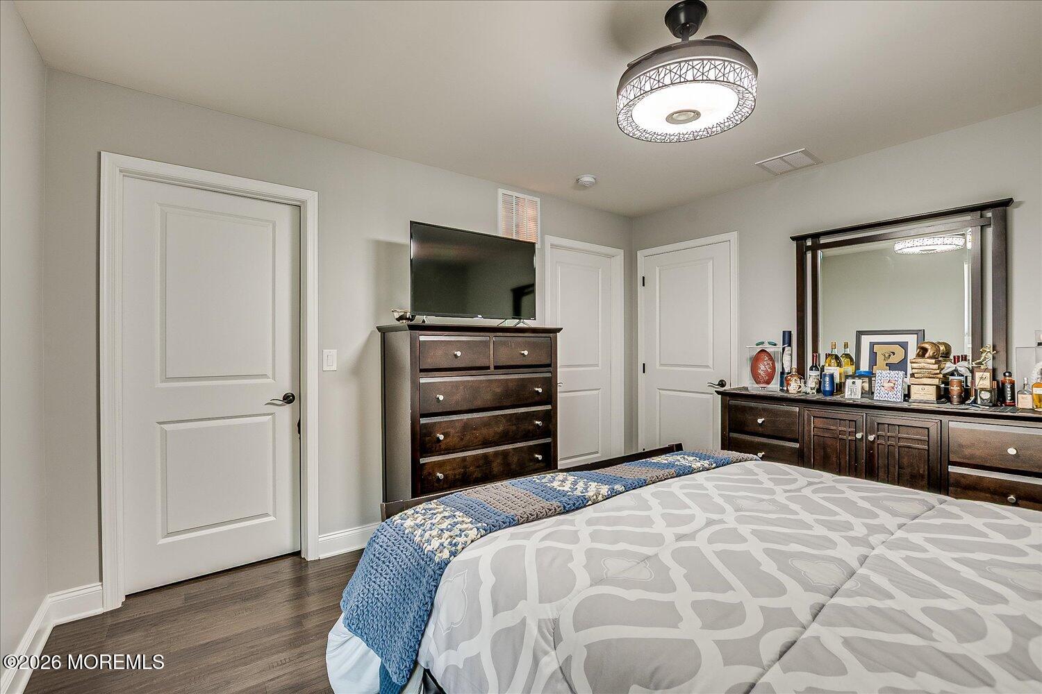 9 Militia Hill Road Freehold, NJ 07728 - Photo 42 of 67 a bedroom with a bed and a television