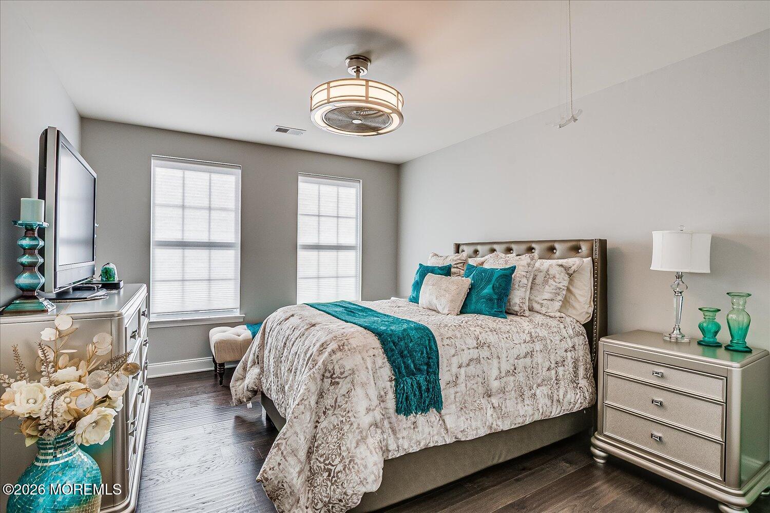 9 Militia Hill Road Freehold, NJ 07728 - Photo 44 of 67 a bedroom with a bed and a chandelier