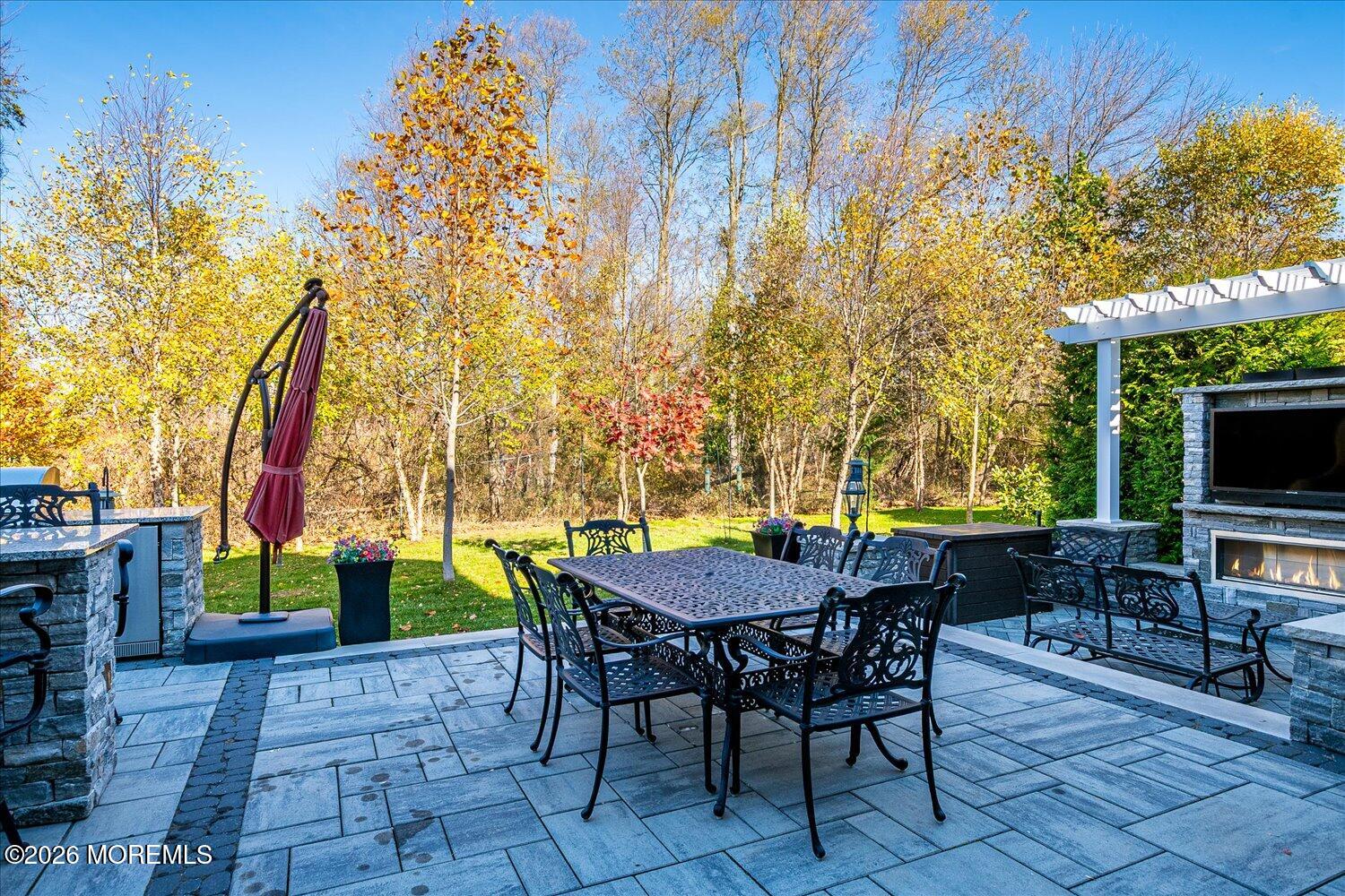 9 Militia Hill Road Freehold, NJ 07728 - Photo 48 of 67 a view of a patio with a table and chairs