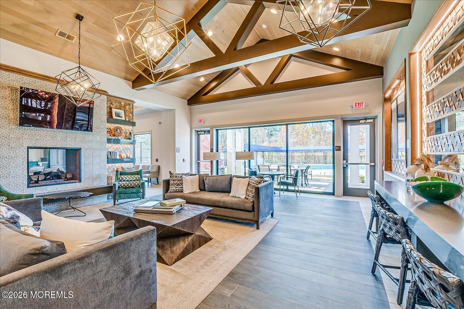 9 Militia Hill Road Freehold, NJ 07728 - Photo 53 of 67 a living room with fireplace furniture and a wooden floor